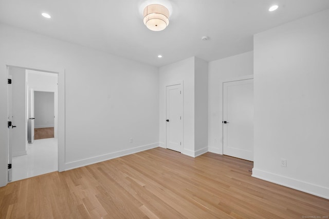 spare room with light wood-type flooring