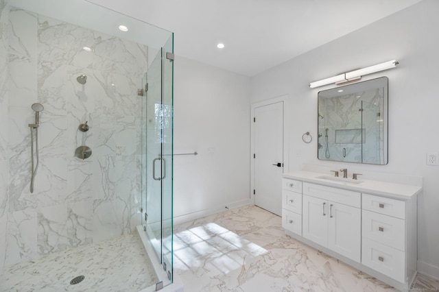 bathroom featuring vanity and a shower with shower door