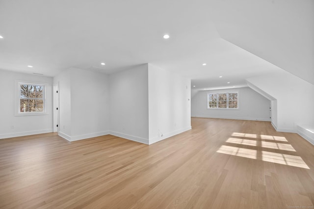 bonus room with light hardwood / wood-style floors