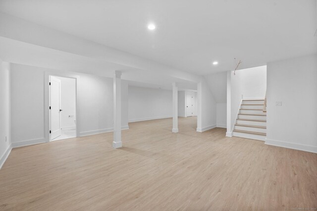 basement featuring light wood-type flooring