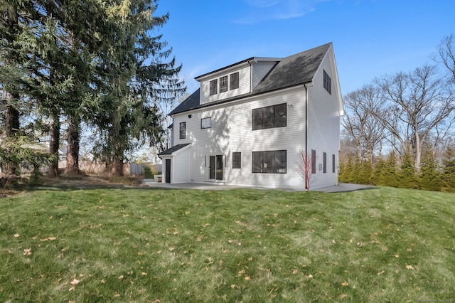 back of property featuring a yard and a patio area