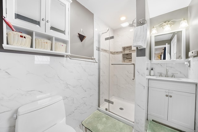 bathroom featuring vanity, tile walls, toilet, and walk in shower