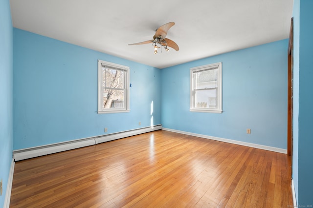 unfurnished room with a baseboard radiator, light hardwood / wood-style floors, and ceiling fan