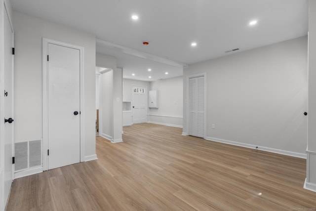 interior space featuring recessed lighting, visible vents, light wood finished floors, and baseboards