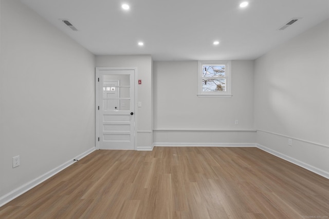 empty room with visible vents, recessed lighting, baseboards, and light wood-style floors