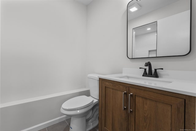 bathroom with tile patterned flooring, toilet, and vanity