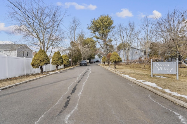 view of street with curbs