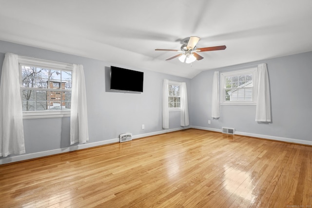 spare room featuring visible vents, baseboards, light wood-type flooring, and a ceiling fan