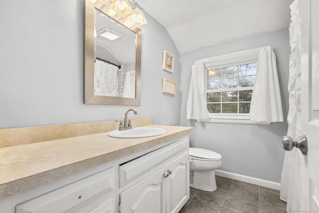 bathroom featuring toilet, a textured ceiling, baseboards, vanity, and vaulted ceiling