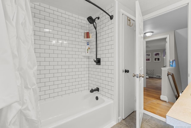 bathroom featuring tile patterned floors and shower / tub combo with curtain