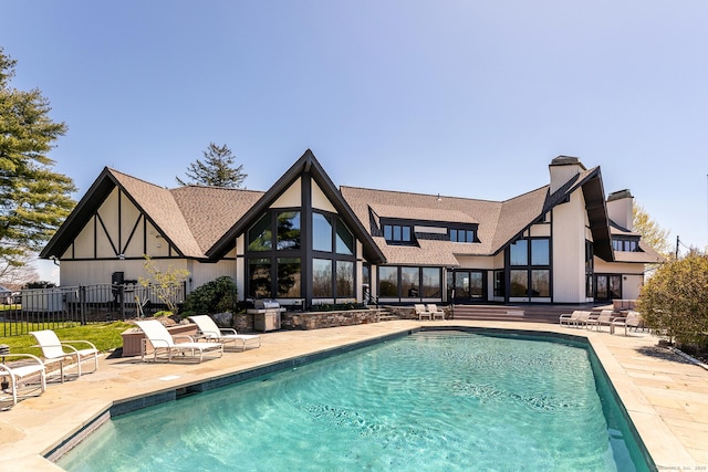 view of swimming pool with a patio area