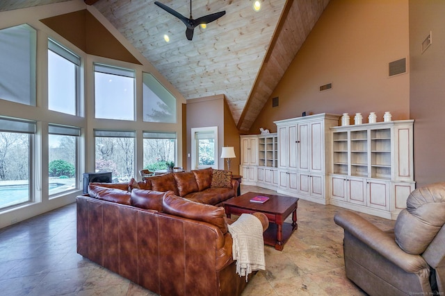 living room featuring ceiling fan and high vaulted ceiling