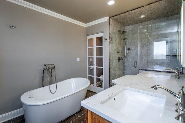 bathroom featuring crown molding, vanity, separate shower and tub, and wood-type flooring