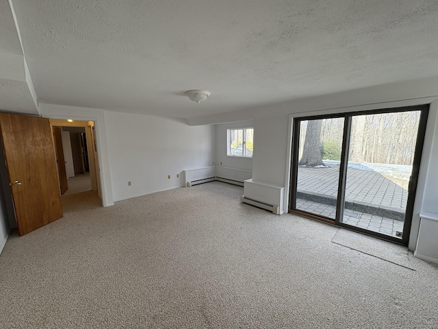 unfurnished room with carpet floors and a textured ceiling