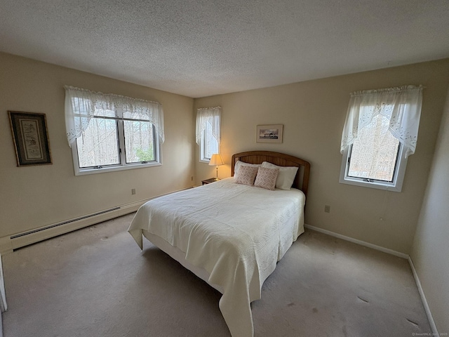 bedroom featuring multiple windows, a baseboard radiator, and light colored carpet