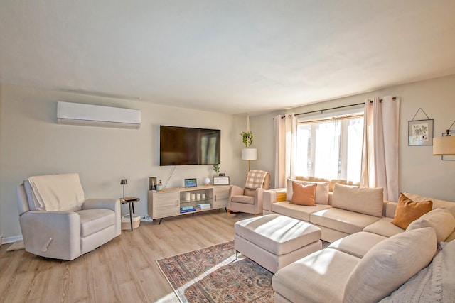 living room with light hardwood / wood-style flooring and an AC wall unit