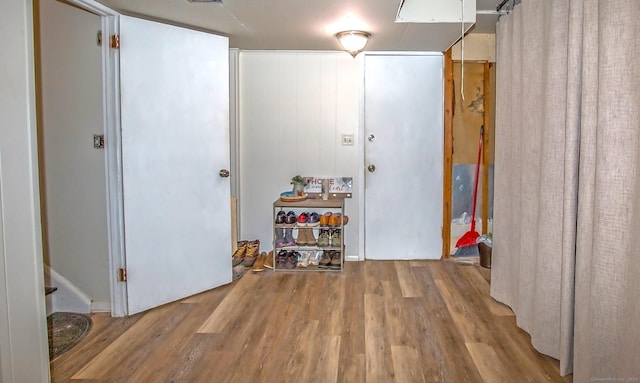 corridor featuring hardwood / wood-style flooring