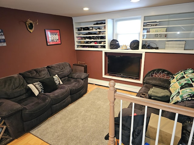 living room with light wood-type flooring and built in shelves