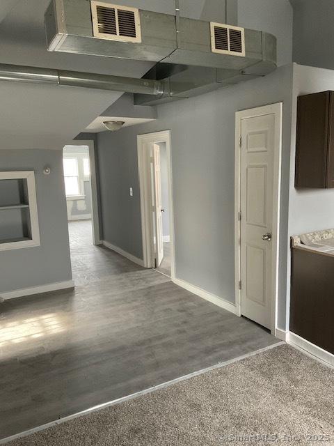 unfurnished room featuring hardwood / wood-style floors