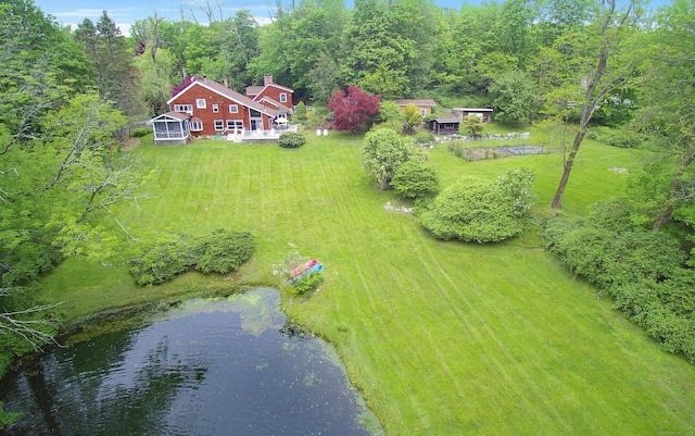 birds eye view of property with a water view