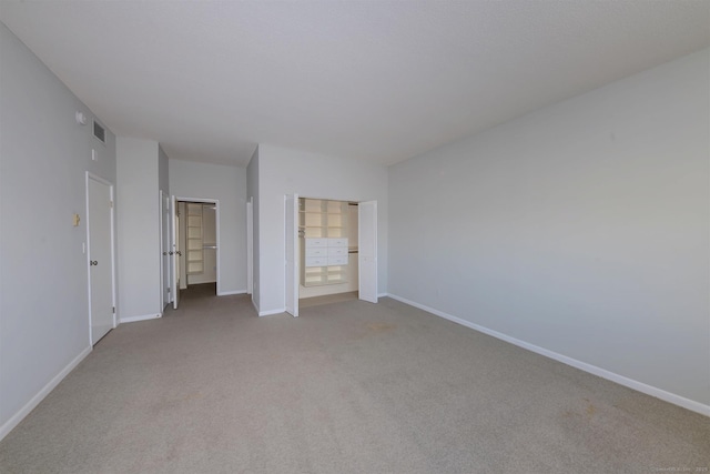 unfurnished bedroom featuring light colored carpet