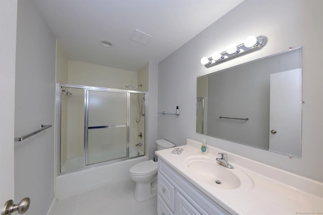 full bathroom with tile patterned floors, toilet, vanity, and shower / bath combination with glass door