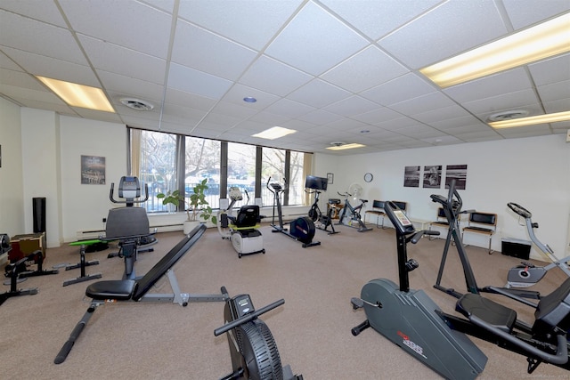 exercise room with a drop ceiling