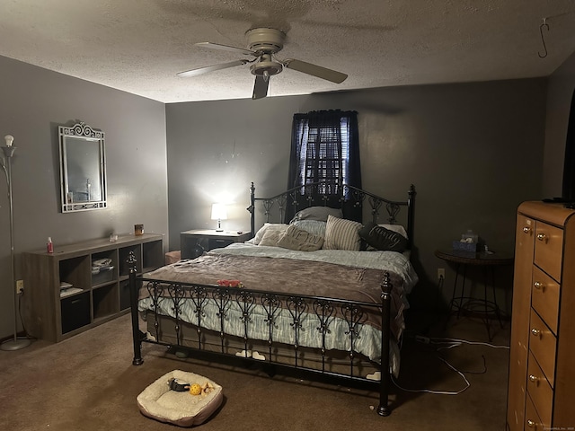 carpeted bedroom with ceiling fan and a textured ceiling