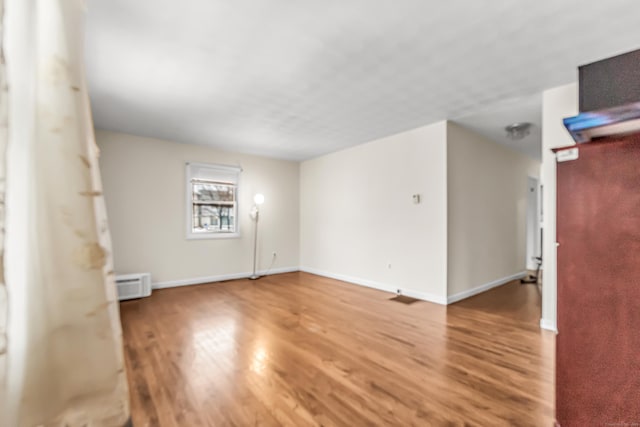 empty room featuring hardwood / wood-style flooring