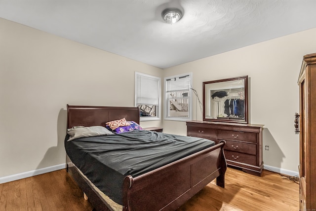 bedroom with light hardwood / wood-style floors