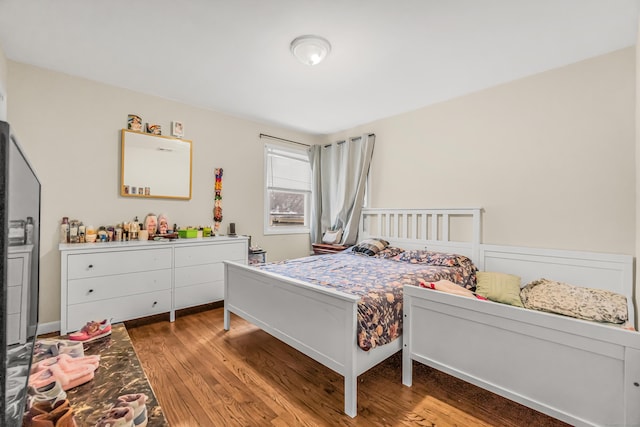 bedroom featuring hardwood / wood-style floors