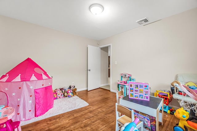 game room with hardwood / wood-style floors