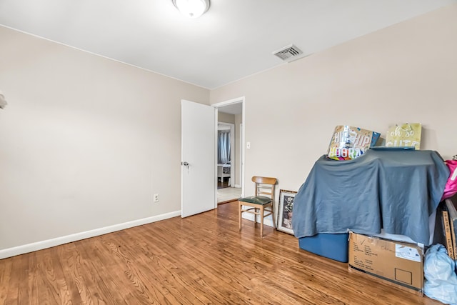 sitting room with hardwood / wood-style floors