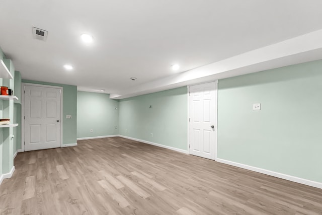 basement featuring light hardwood / wood-style floors