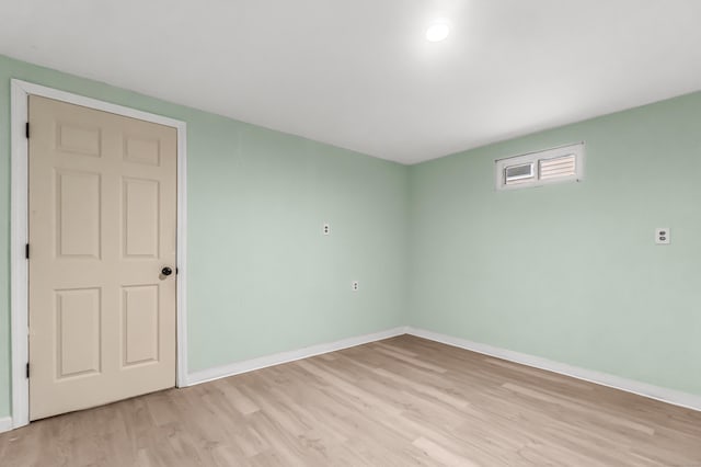 spare room with light hardwood / wood-style flooring