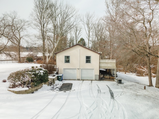 exterior space featuring a garage and a deck