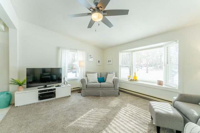 carpeted living room featuring a healthy amount of sunlight, a baseboard radiator, and lofted ceiling