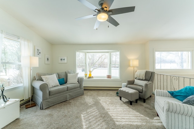 carpeted living room featuring lofted ceiling, a baseboard radiator, and ceiling fan