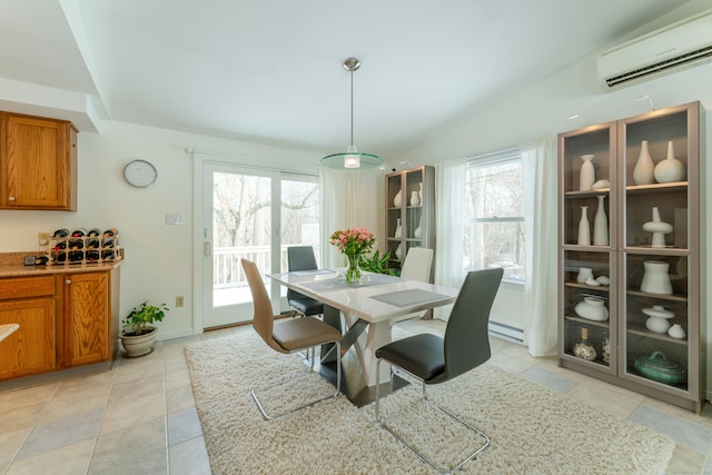 dining space with a baseboard heating unit, vaulted ceiling, an AC wall unit, and light tile patterned flooring