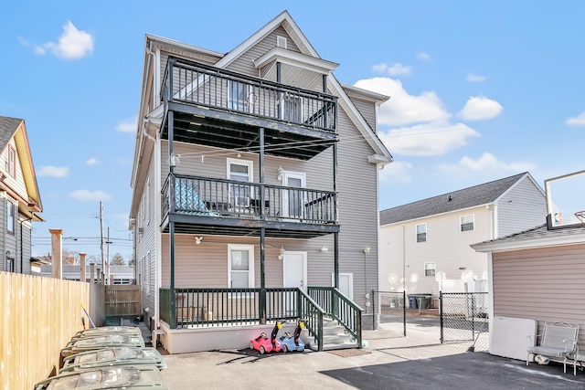 back of house with a balcony