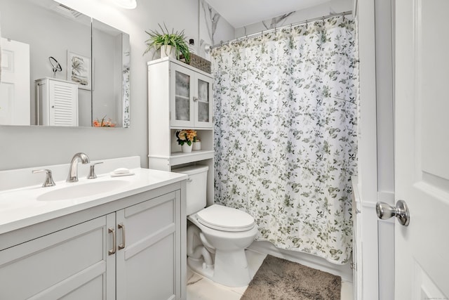 bathroom featuring vanity, a shower with curtain, and toilet