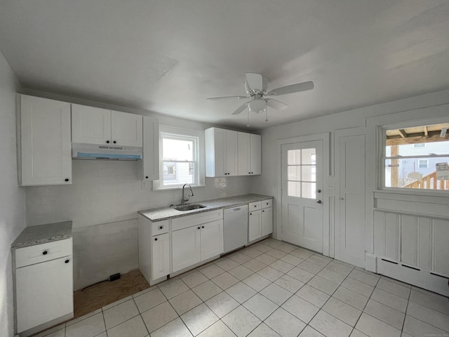 kitchen with light tile patterned flooring, sink, white dishwasher, ceiling fan, and white cabinets