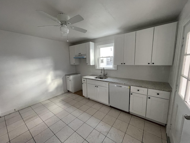 kitchen with dishwasher, sink, light tile patterned floors, and white cabinets