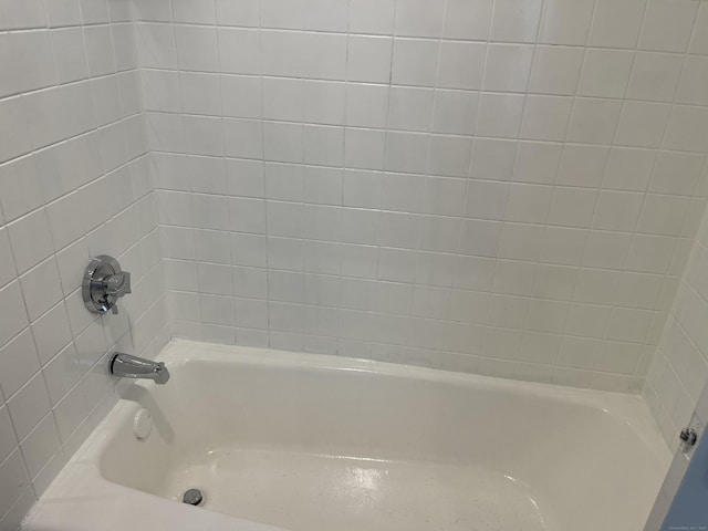 bathroom with a tub to relax in