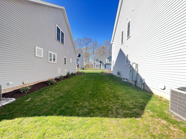 view of yard with central AC unit