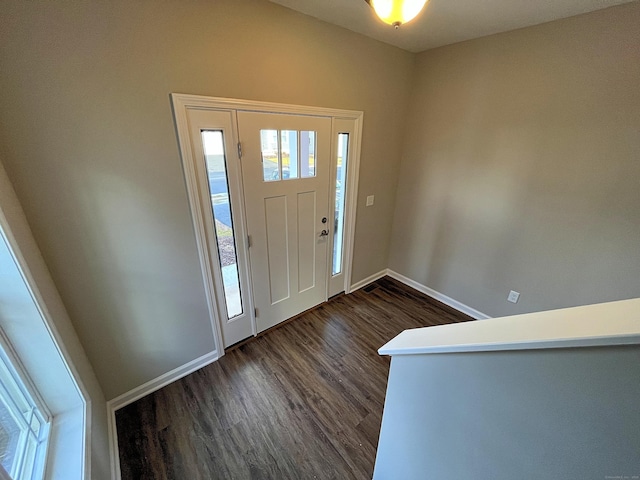 entryway with dark wood-type flooring