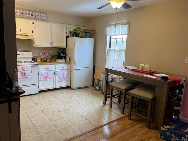 kitchen with ceiling fan, light tile patterned floors, white cabinets, and white appliances