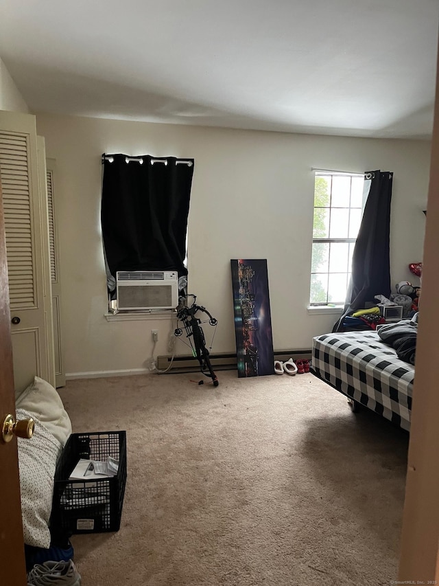 bedroom featuring cooling unit, carpet floors, and a baseboard radiator