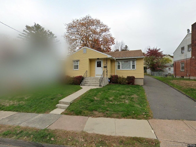 view of front of home with a front lawn