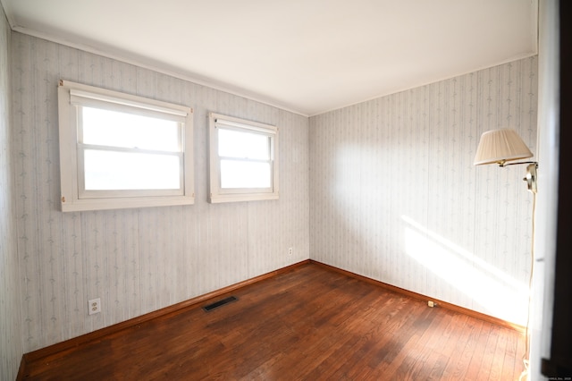 unfurnished room featuring wood-type flooring